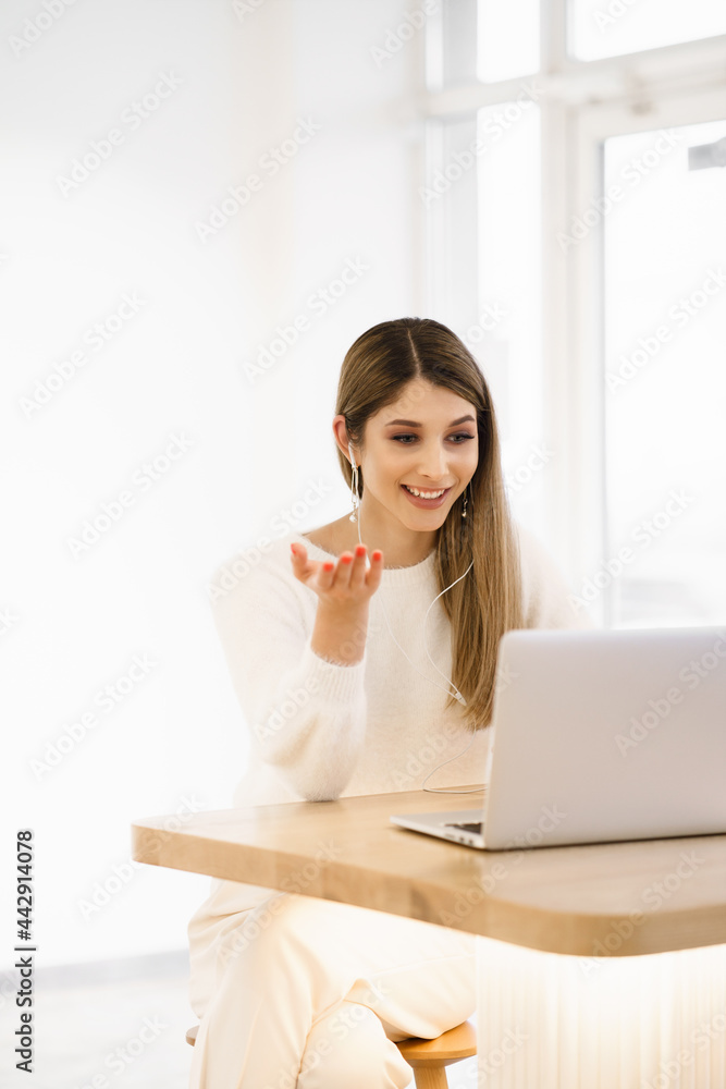 Smiling mixed race lady freelancer, communicating with client via video computer call. Millennial pleasant professional female tutor giving online language class. Smiling mixed race lady freelancer, communicating with client via video computer call. Millennial pleasant professional female tutor giving online language class.