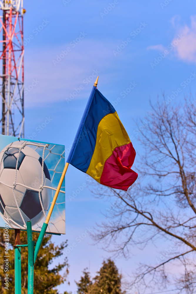 the flag of Romania with a soccer ball