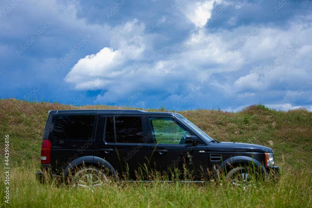 a 4x4 car in nature out of focus, concept image