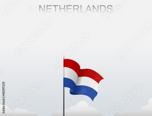 Netherlands flag flying on a pole standing tall under a white sky Free Download Netherlands flag flying on a pole standing tall under a white sky - GFXLoad