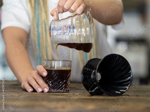 The process of brewing special coffee. Brewing coffee in a funnel. v-60 stages of brewing coffee. how to prepare a coffee filter, the brewing process. Work as a barista. Third Wave Coffee Shop