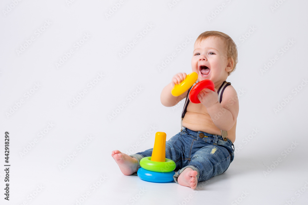 toddler baby boy with toy on white background toddler baby boy with toy on white background