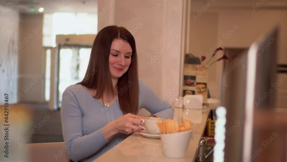 Young woman with long loose hair eats chocolate sweet Young woman with long loose hair eats chocolate sweet