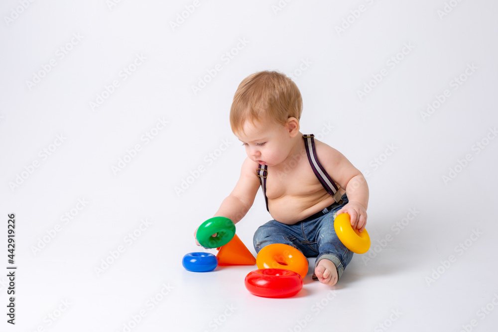toddler baby boy with toy on white background toddler baby boy with toy on white background