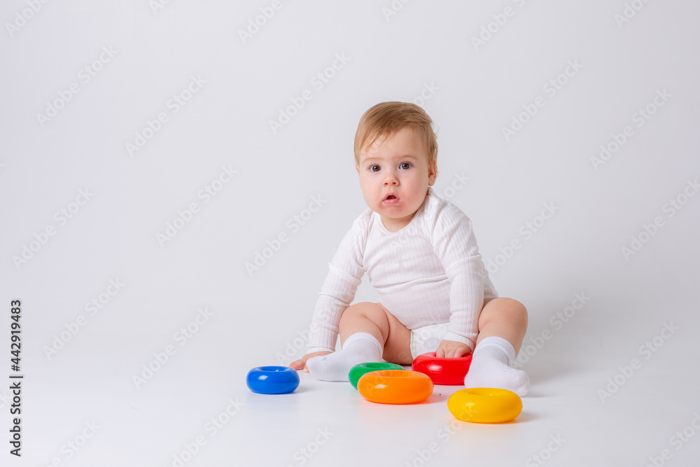 toddler boy with toy on white background toddler boy with toy on white background