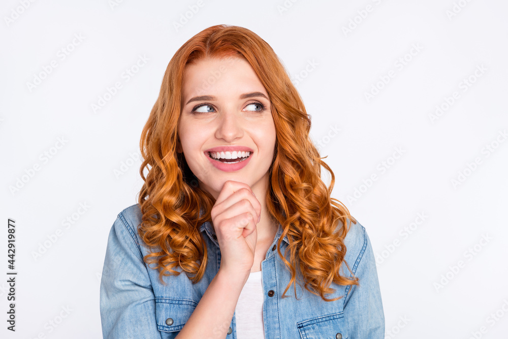 Photo of attractive young minded lady look empty space dream hold hand chin isolated on grey color background Photo of attractive young minded lady look empty space dream hold hand chin isolated on grey color background