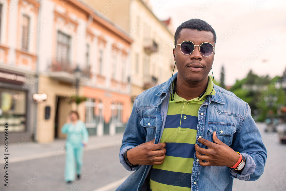 Portrait of handsome model boy posing in sunglasses Portrait of handsome model boy posing in sunglasses