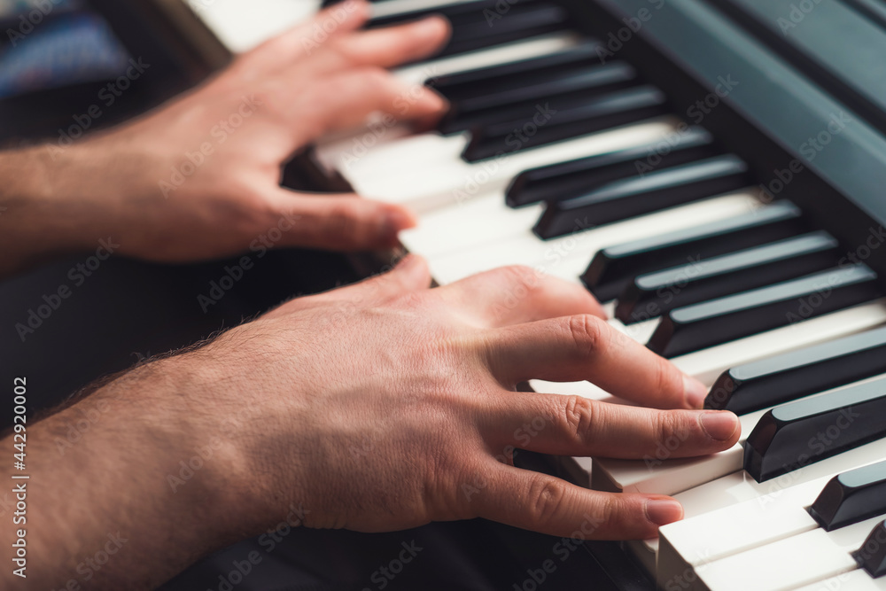 Man playing piano close up Man playing piano close up