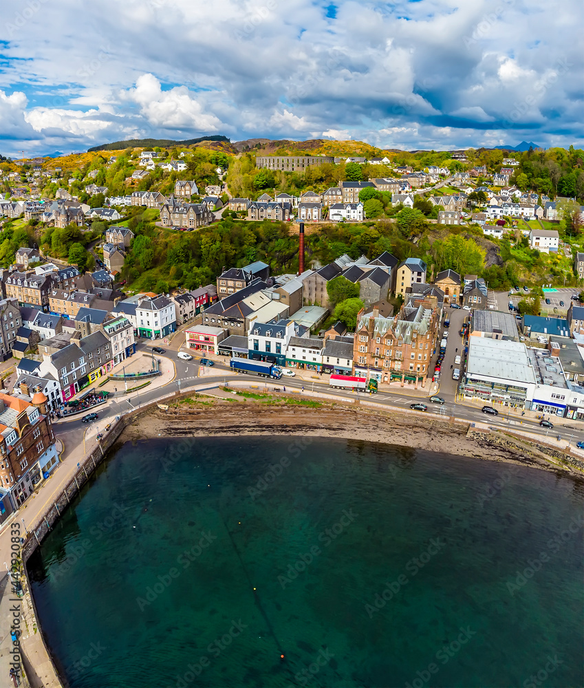 An aerial view above the seafront of the town of Oban, Scotland on a summers day