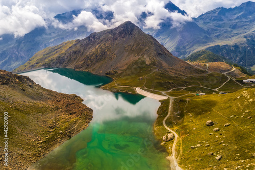 Aerial view of dam in inspiring alpine mountains