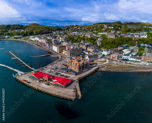 An aerial view above a landing stage and the town of Oban, Scotland on a summers day