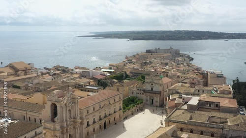Beautiful drone view of the narrow streets and roofs of Siracusa Ortigia in a stunning sunny summer day in Sicily, Italy.