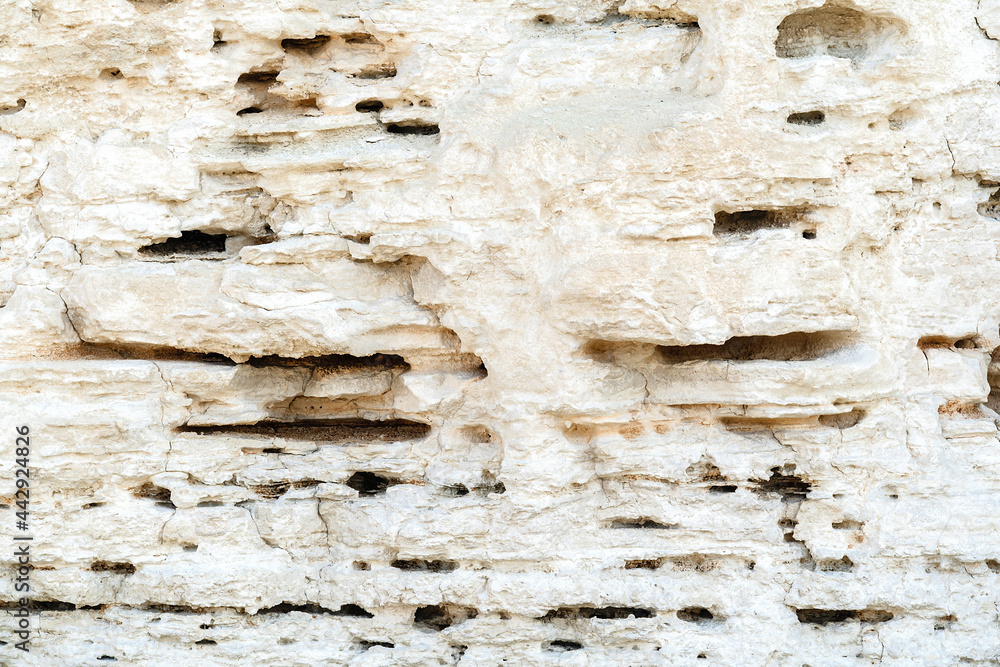 Whitestone Layer Beautiful natural cliff surface white limestone background. Multiple ...