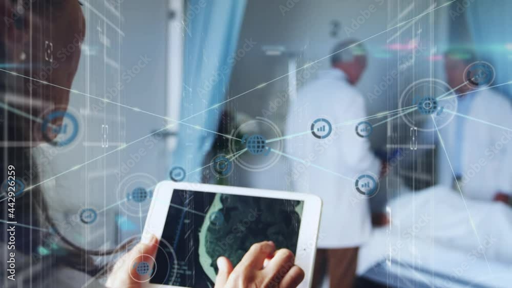 Network of digital icons floating against female doctor using digital tablet at hospital Network of digital icons floating against female doctor using digital tablet at hospital