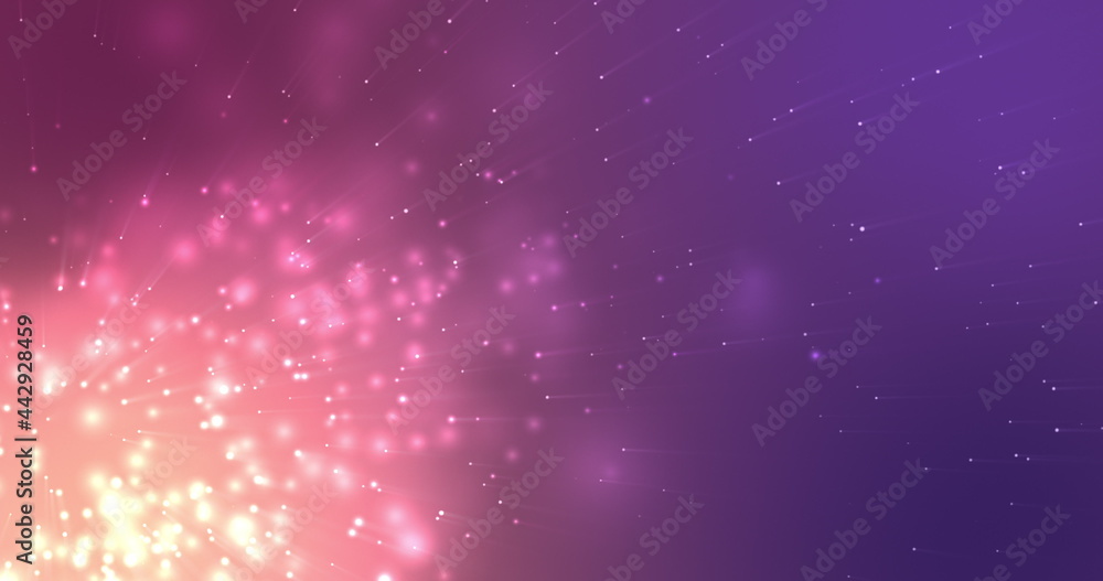 Glowing pink particles effervescing on a dark purple background