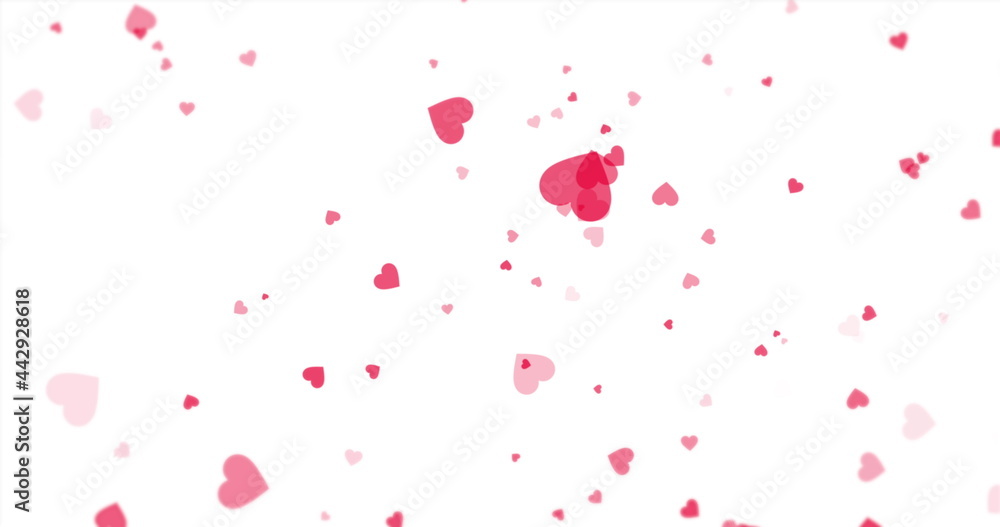 Pink hearts floating around on a white background