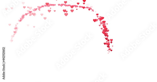 Trail of small red hearts flying around on white background