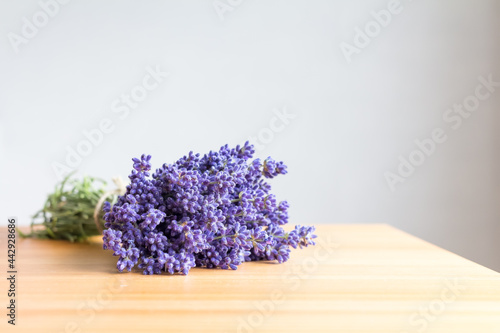 A bouquet of lavender tied with twine on a table