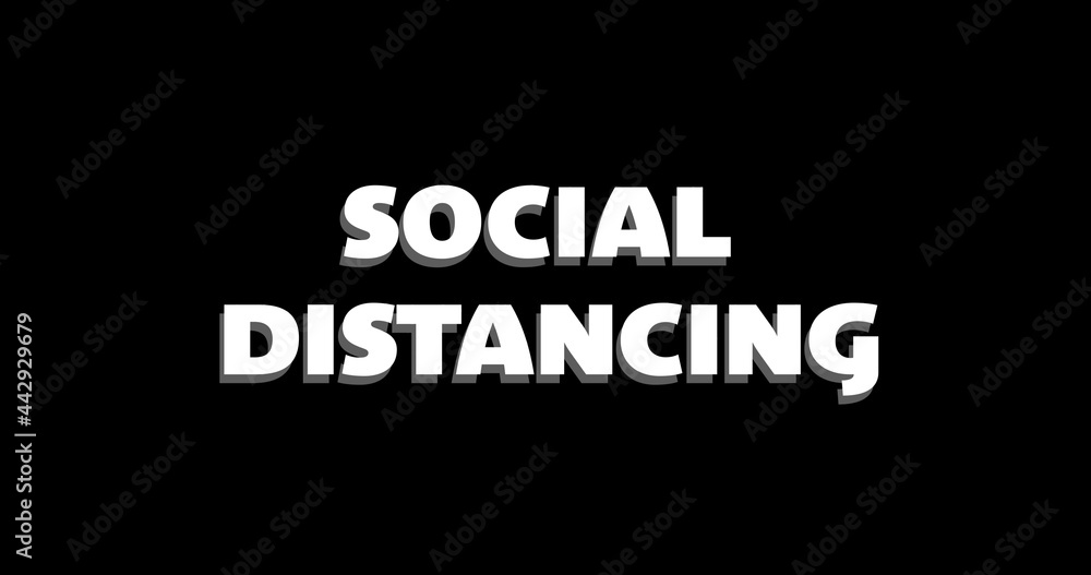 Social distancing text dissolving against black background Social distancing text dissolving against black background