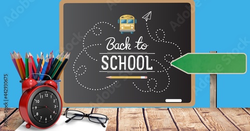 Composition of back to school text and school items