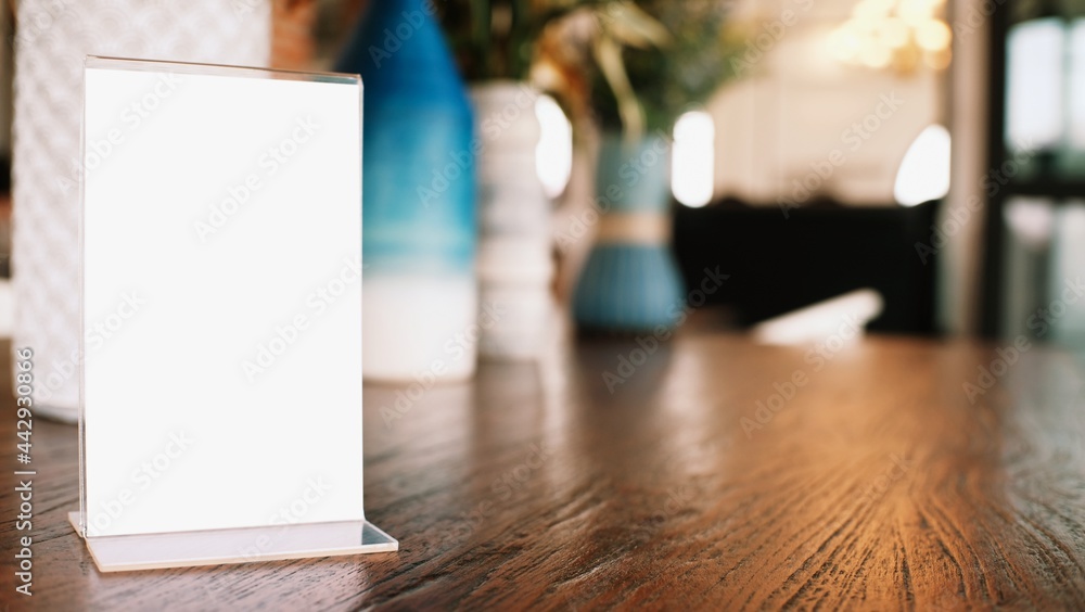 Menu frame standing on wood table in Bar restaurant cafe. space for text marketing promotion. Menu frame standing on wood table in Bar restaurant cafe. space for text marketing promotion.