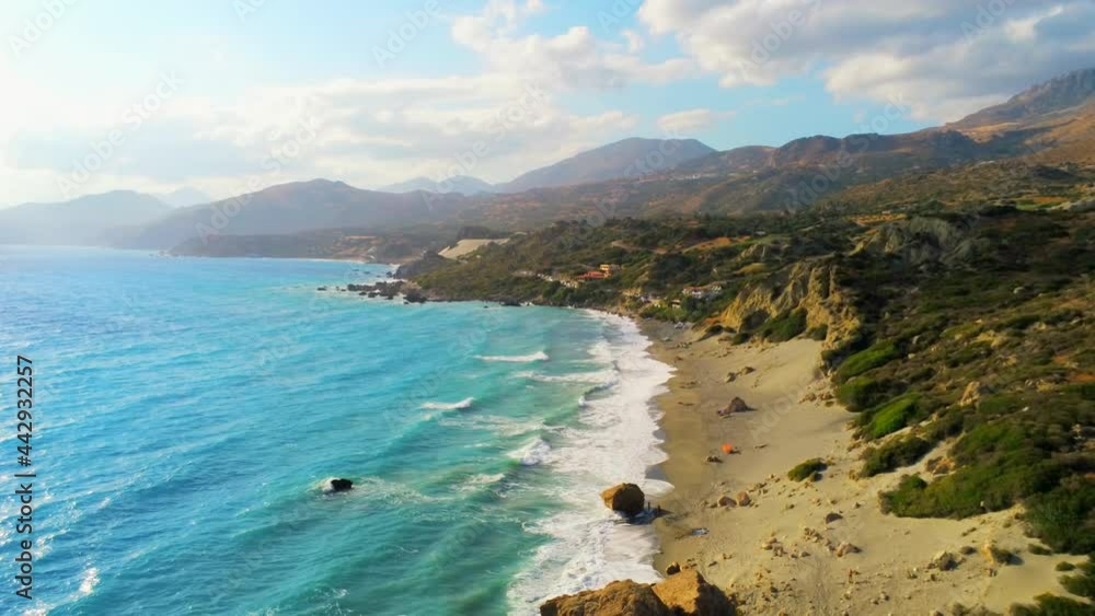 Scenic Aerial View of Natural Landscape of Ligres Beach at Mediterranean Sea in Crete, Greece. Beautiful Turquoise Waves, Sand and Rocks as Tropical Tourism Destination. 4K Drone High to Low Shot Scenic Aerial View of Natural Landscape of Ligres Beach at Mediterranean Sea in Crete, Greece. Beautiful Turquoise Waves, Sand and Rocks as Tropical Tourism Destination. 4K Drone High to Low Shot