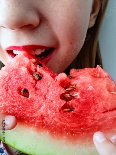 child eating watermelon