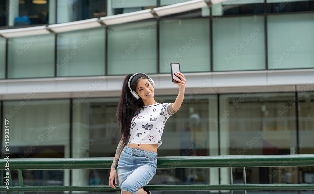 Young Asian female taking selfie on street Young Asian female taking selfie on street