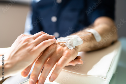 Nurse Or Doctor Examines Oncology Patient Catheter