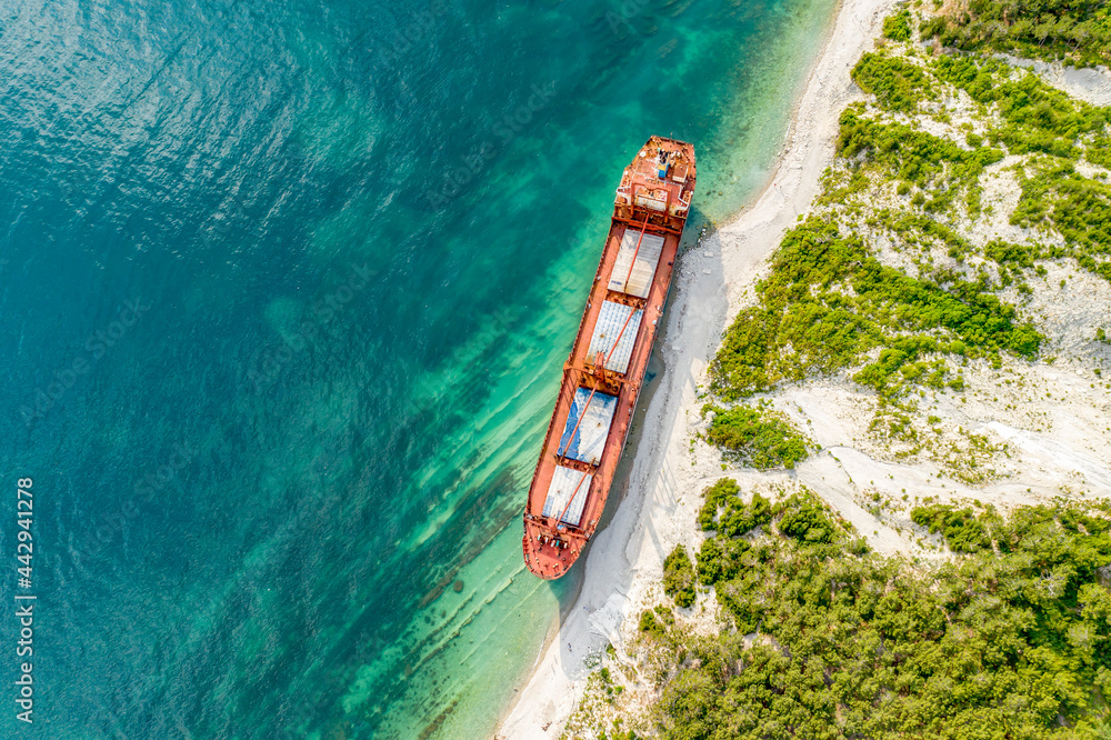 Kabardinka, Russia - June 24, 2021 Dry cargo ship RIO on the shore left after a shipwreck. Kabardinka, Russia - June 24, 2021 Dry cargo ship RIO on the shore left after a shipwreck.