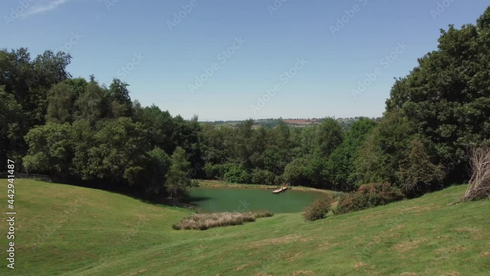 Drone Shot Flying Through Brick Arch to Reveal a Scenic Lake On Edge of Woodland Drone Shot Flying Through Brick Arch to Reveal a Scenic Lake On Edge of Woodland