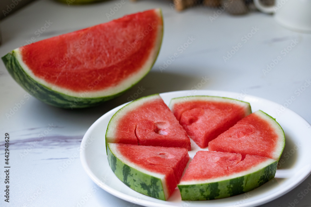 fresh watermelon slices in a white plate