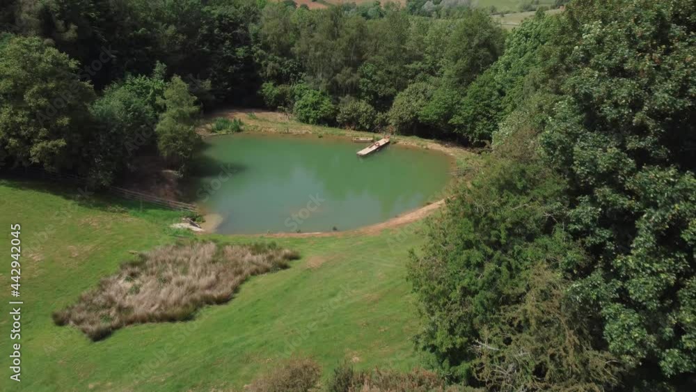 Drone Shot Approaching Scenic Lake On Edge of Woodland Drone Shot Approaching Scenic Lake On Edge of Woodland