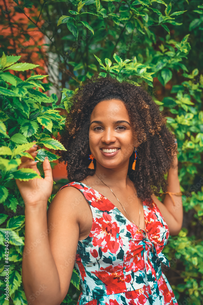 portrait of a black woman smiling with a curly hair portrait of a black woman smiling with a curly hair