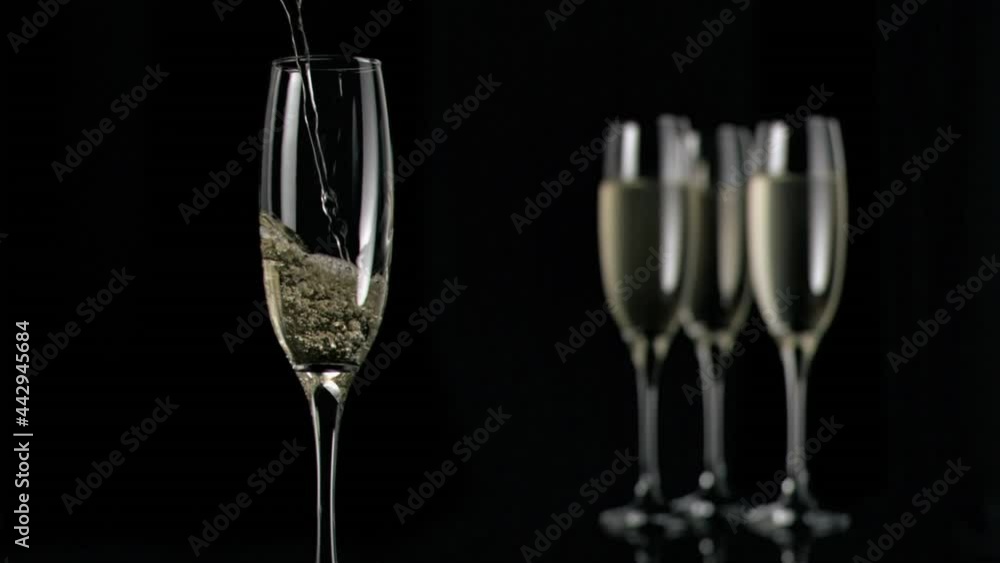 Animation of burning layer over glasses of champagne on black background Animation of burning layer over glasses of champagne on black background