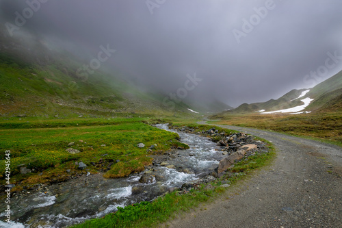 alpin river and misty mountains (Vorarlberg, Austria)