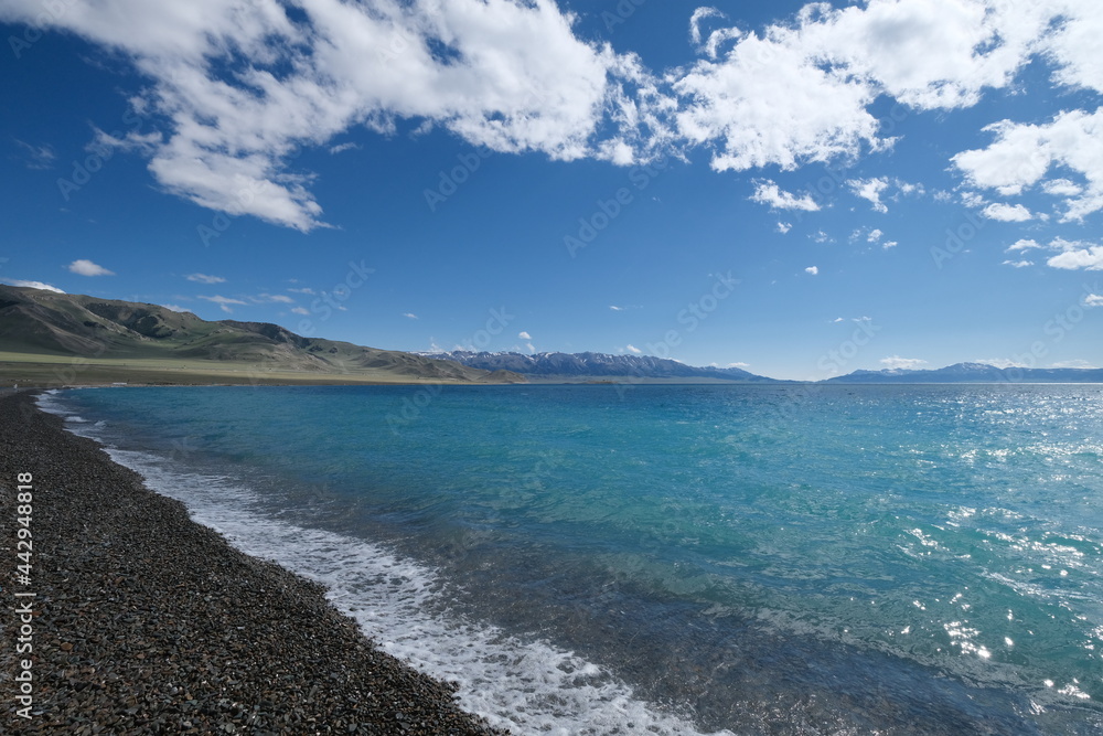 shoreline of Sayram Lake. beautiful blue water under sunshine. Travel destination of Xinjiang China