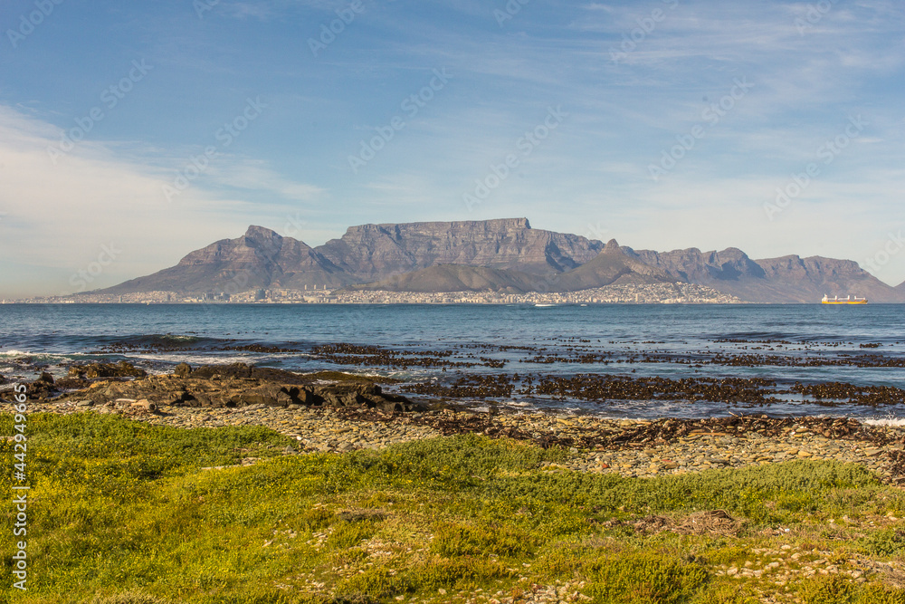 Table Mountain seen in a sunny morning from Robben Island, a prison island in Cape Town, South Africa.