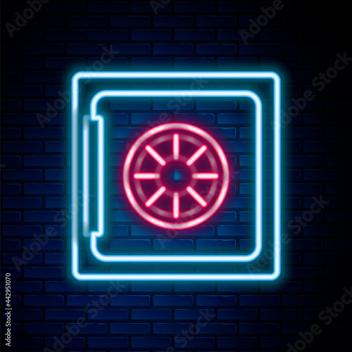Glowing neon line Safe icon isolated on brick wall background. The door safe a bank vault with a combination lock. Reliable Data Protection. Colorful outline concept. Vector