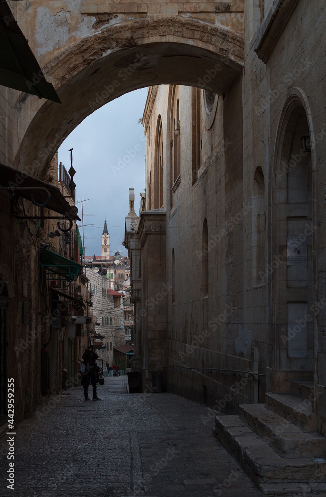 Via Dolorosa streetin Jerusalem. Old City arches and temples