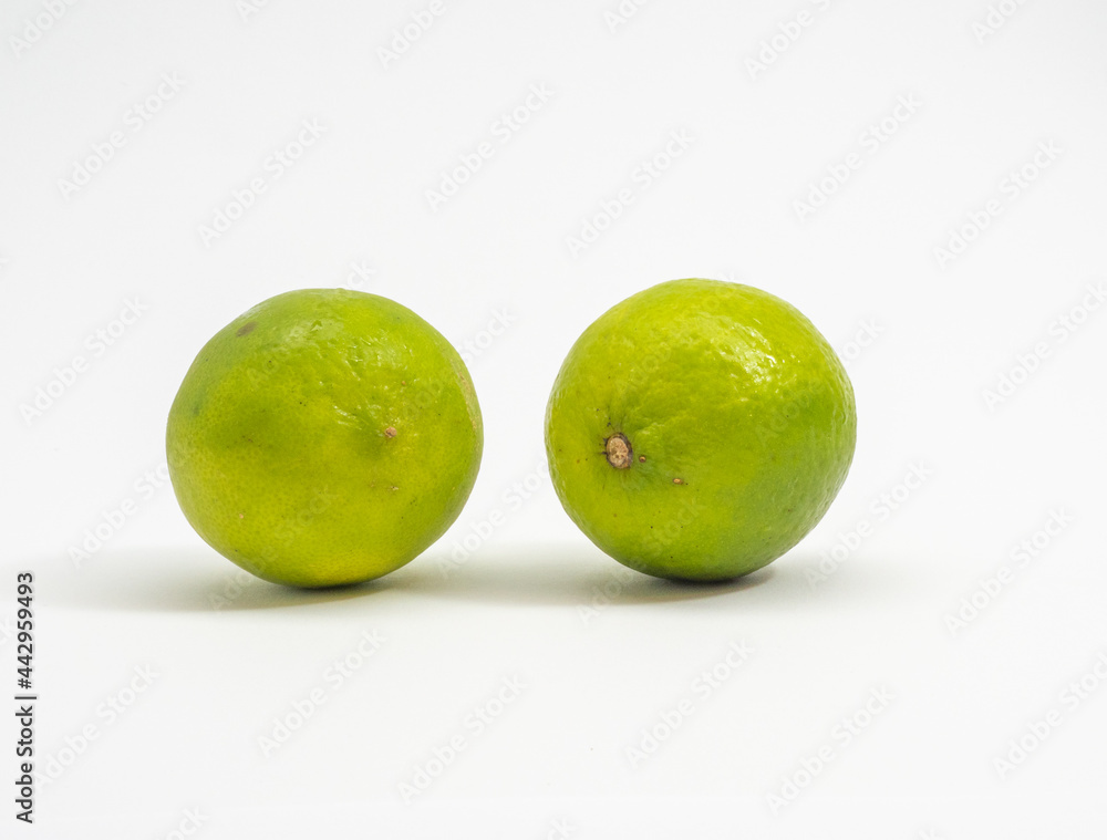 Limes on a white background. Fresh and ripe. Limes on a white background. Fresh and ripe.