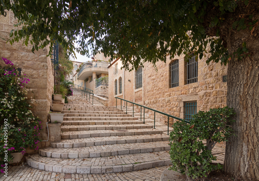 Jerusalem historic neighborhood Yemin Moshe. Big stone staicase and tree