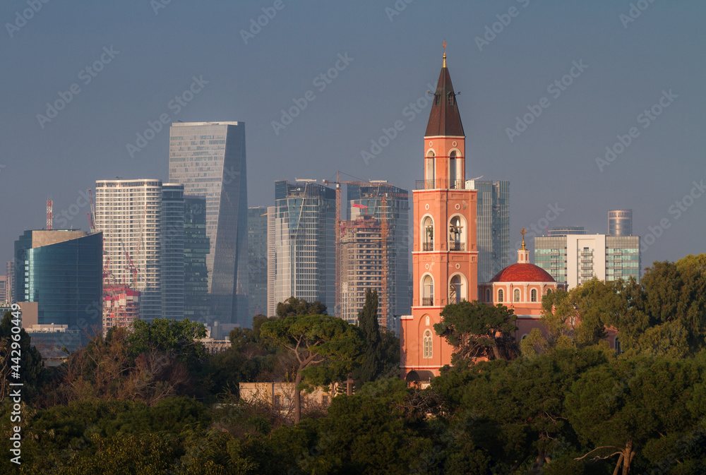 Tel Aviv: Russian Orthodox church and modern skyscrapers at sunset
