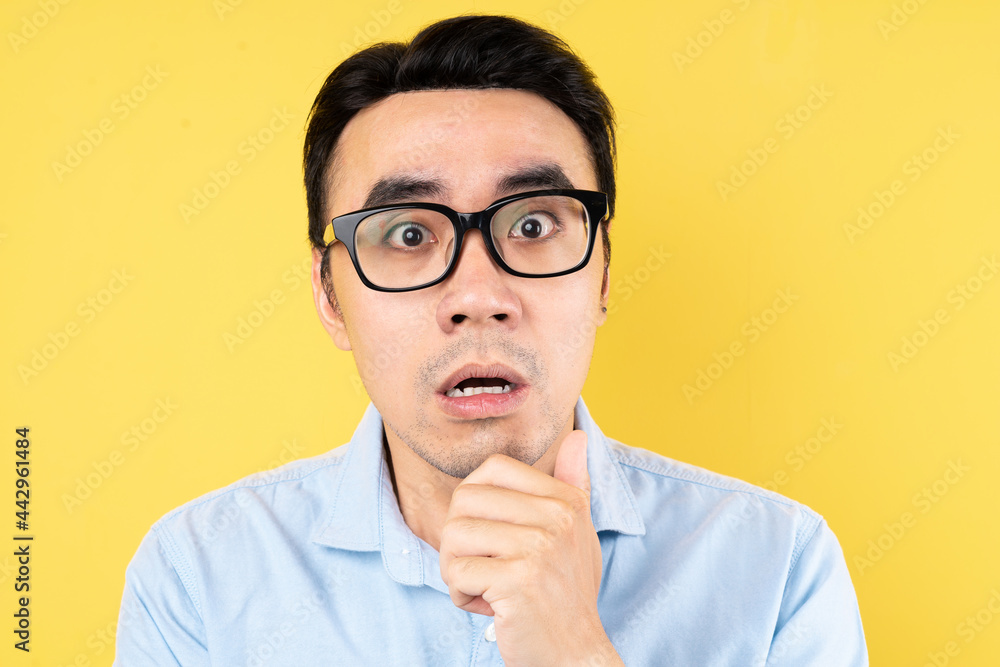 male portrait wearing shirt, isolated on yellow background male portrait wearing shirt, isolated on yellow background