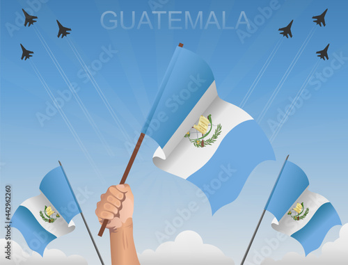 Guatemala flags fluttering under the blue sky