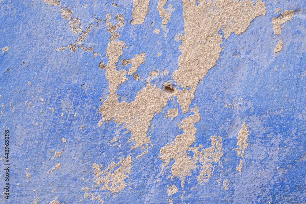 Texture of an old plastered wall, whitewashed in blue. Close-up, wallpaper, background. Texture of an old plastered wall, whitewashed in blue. Close-up, wallpaper, background.