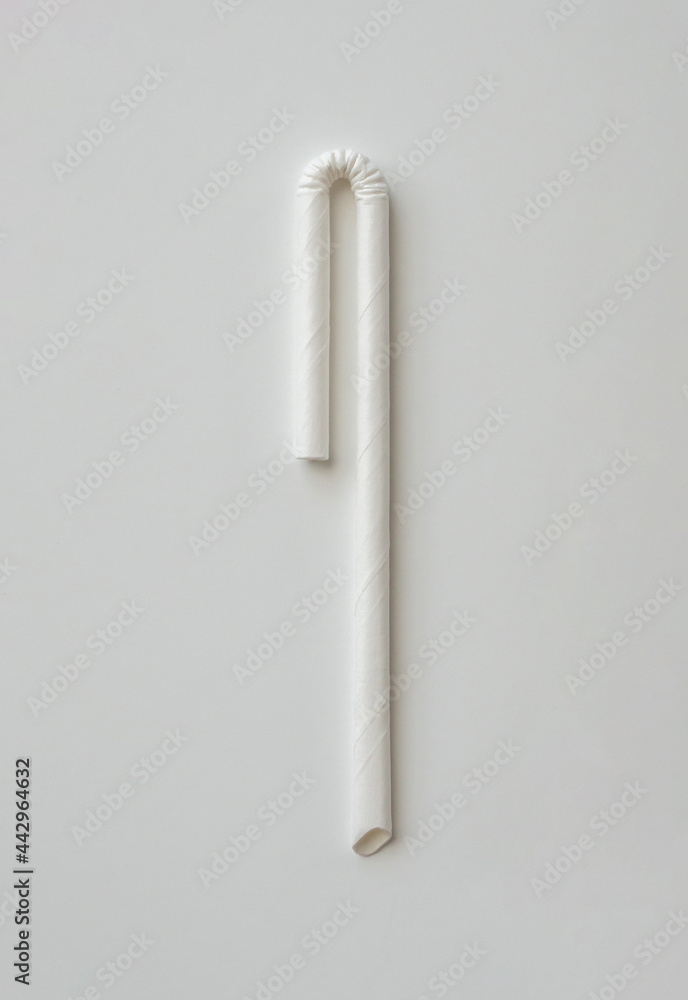 Biodegradable eco friendly white paper drinking straw on white background Biodegradable eco friendly white paper drinking straw on white background