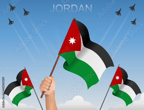 Jordan flags fluttering under the blue sky