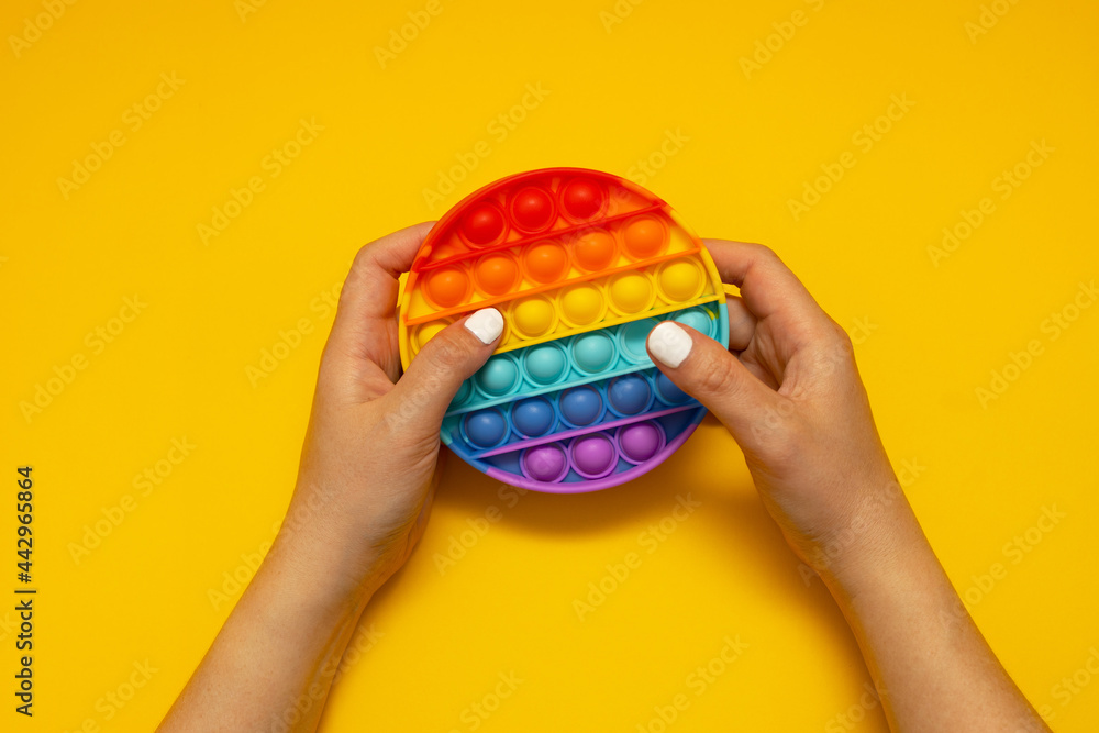 Colorful antistress toy fidget push pop it in kid's hands
