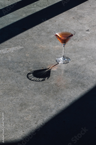 pink martini cocktail harsh shadow sunlight  © Nicole Kandi
